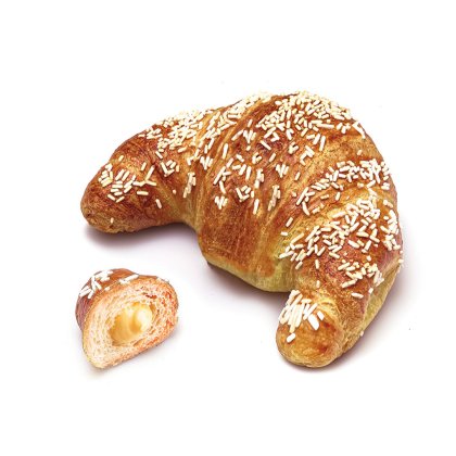 Złocisty croissant z białą posypką, obok mniejszy kawałek z kremowym nadzieniem waniliowym.