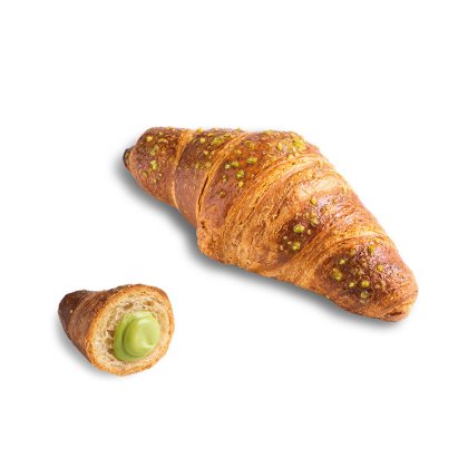 Złocisty croissant posypany pistacjami, z mniejszym kawałkiem przekrojonym, ukazującym krem pistacjowy.